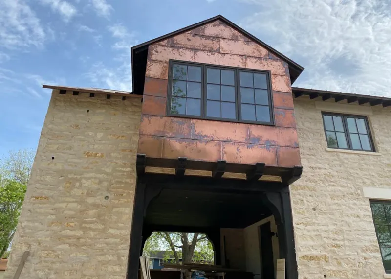 Copper metal panel facade on a stone building for Metal Roof Coating in Indian Wells